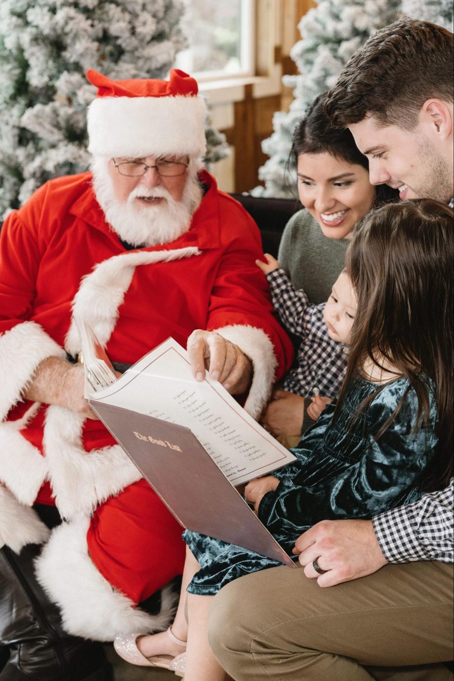 Children reading a letter with Santa during holiday photos