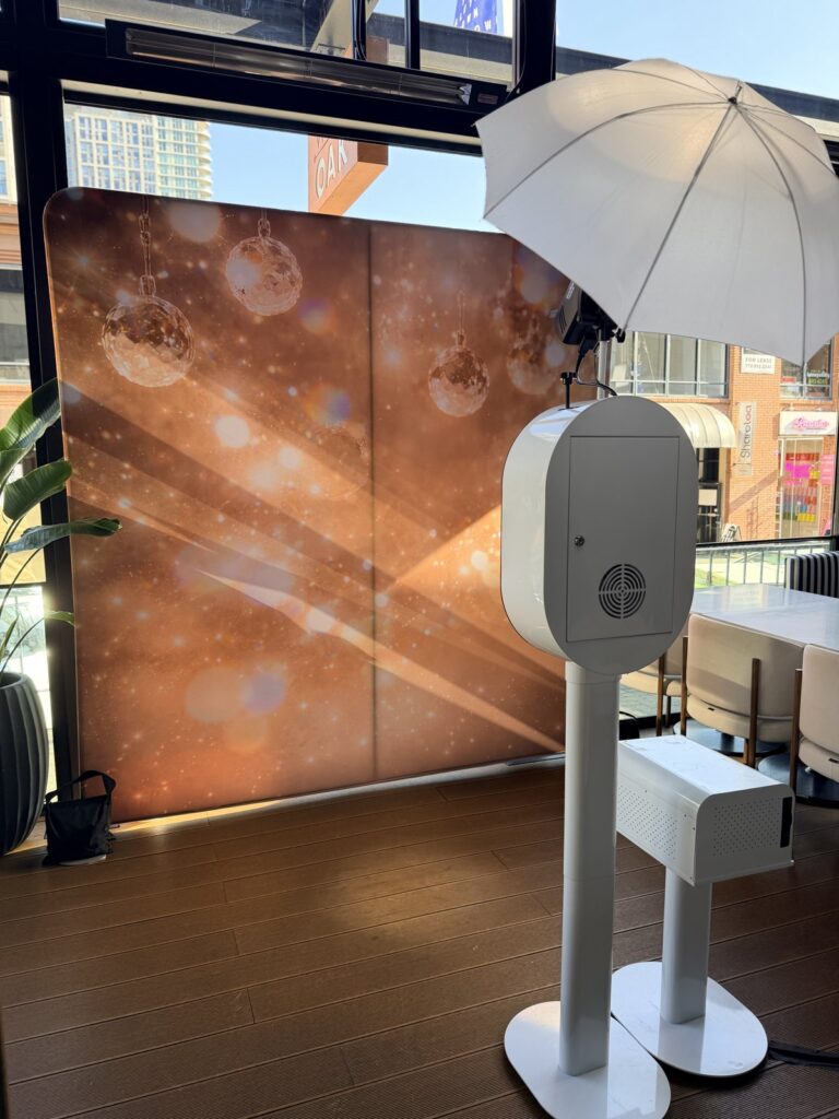 Photo booth with a champagne sparkle backdrop on the West Oak patio in Vancouver for Vancouver Social Club