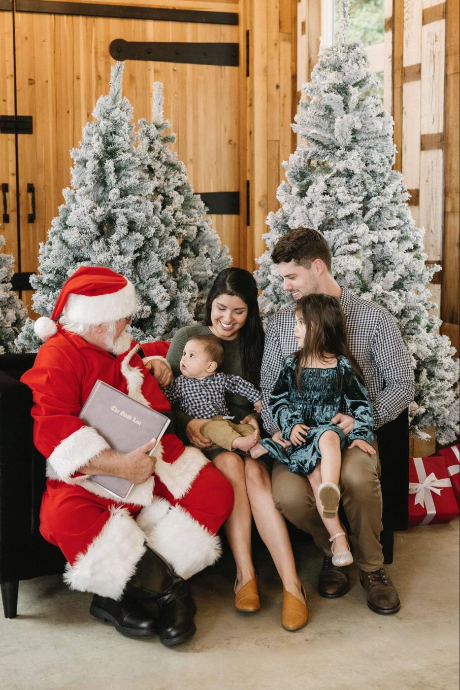 Family sitting with Santa for holiday mini session photos